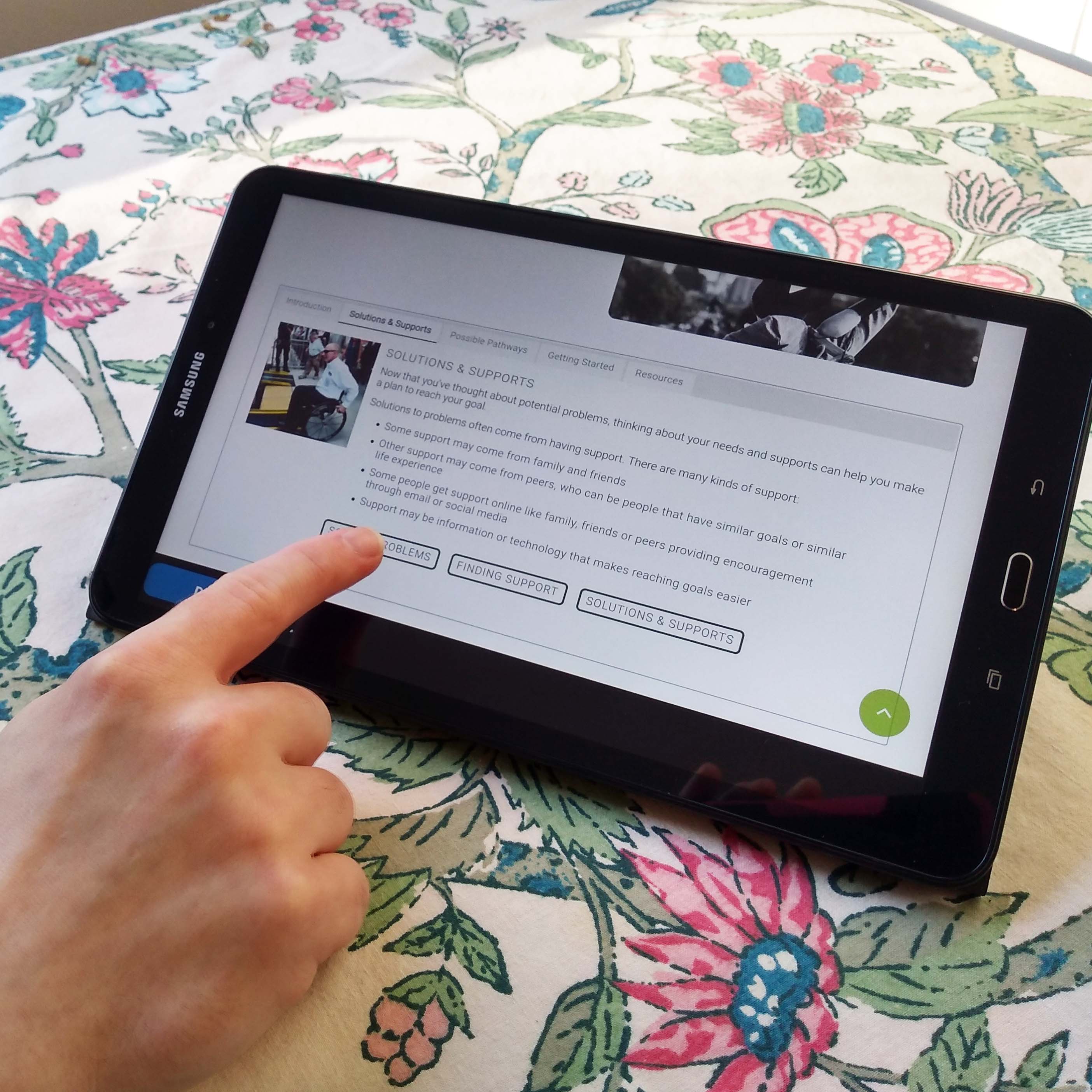 Photo of a person using a tablet and the health my way app